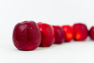 Red apples on the white background 