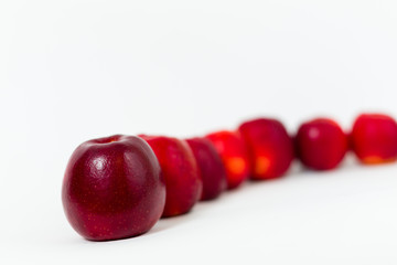 Red apples on the white background 