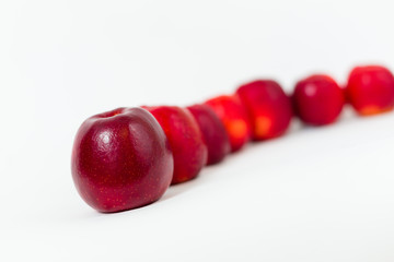 Red apples on the white background 