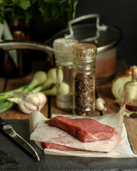 Raw meat, beef steak. a set of ingredients for cooking meat. . food background. top view