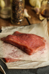 Raw meat, beef steak. a set of ingredients for cooking meat. . food background. top view