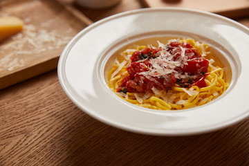 plate of delicious pasta on wooden table
