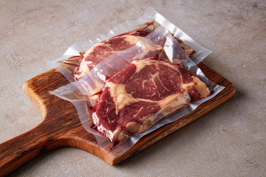 Beef Steak Vacuum Sealed On Stone Table