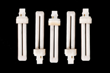 OLD FLUORESCENT LIGHT ISOLATED ON BLACK BACKGROUND.
