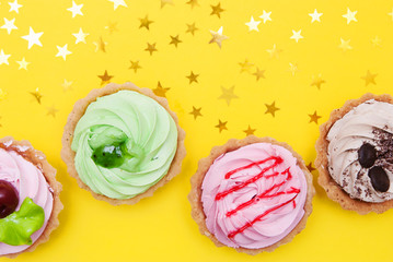 Cakes on yellow background.

