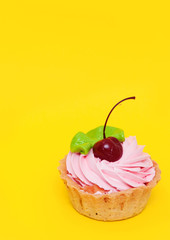 Delicious cake on yellow background.

