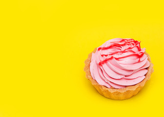 Delicious cake on yellow background.
