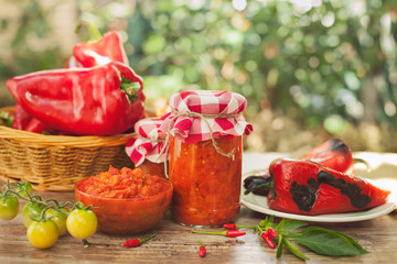Ajvar in a glass jar and glass bowl