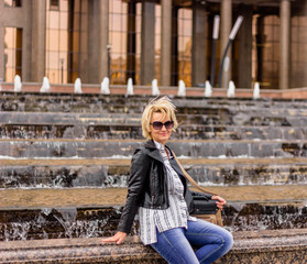 happy woman by the fountain