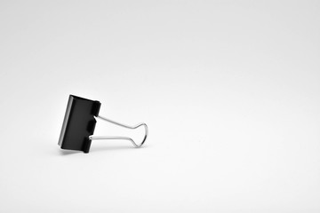 Obraz premium Black paper clip isolated on white background.