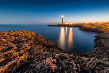 Fototapeta na wymiar Artrutx Lighthouse in Minorca, Spain.