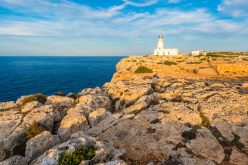 Fototapeta na wymiar Sunset in Cavalleria Lighthouse on Minorca Island northern shore, Balearic Islands, Spain.