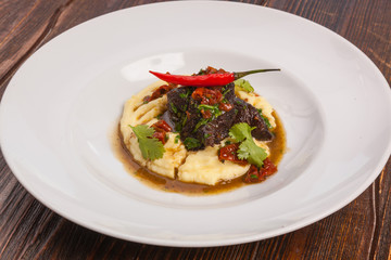 Beef with mashed potatoes and meat sauce