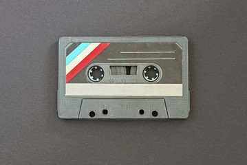 Retro audio tape on black paper background