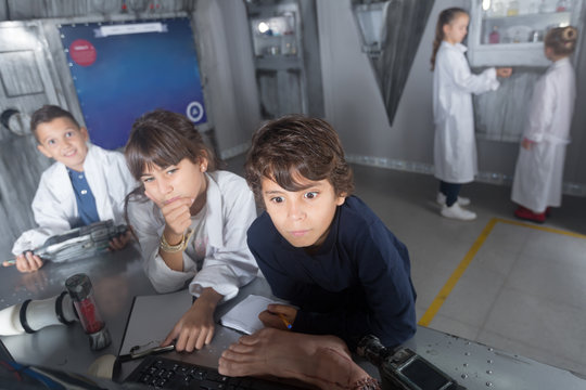 children solve tasks in the bunker quest room