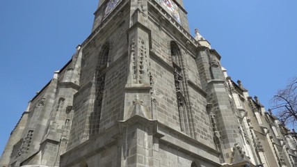 Footage of gothic architecture, The Black Church in Brasov, Romania, corner view tilt