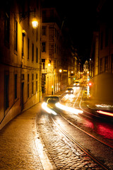 Fototapeta na wymiar Urban night scene. Old European city illuminated street at night, Lisbon, Portugal