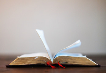 Bible books on wood table.