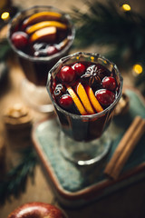 Mulled wine in glasses on blue table