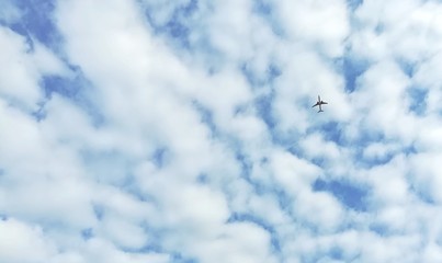 A plane flying to cloudy in the sky. 