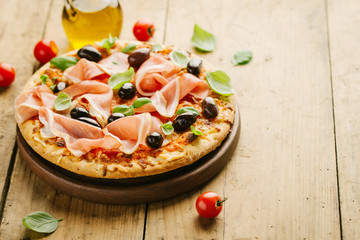 Italian pizza on wooden table