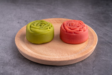 Red and green Mid-Autumn festival mooncakes are displayed