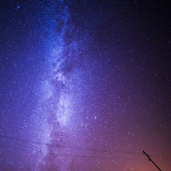 Milky Way and Starry Night Sky over Telegraph Post.