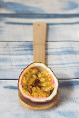 passion fruit on wooden spoon