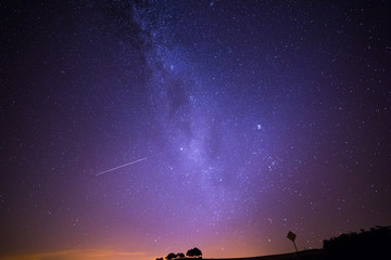 Shooting Stars Crossing in Milky Way and Starry Sky before Dawn.