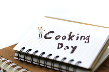 Miniature people : chef cooking using for concept of Cooking day.