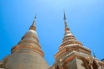 Fototapeta premium Golden Pagoda with in Wat Phra Singh , temple in Chiang Mai, Thailand.