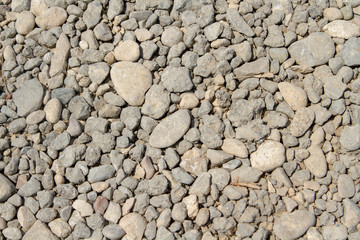 The texture of a highway in a desert maze for use as a background. The rolled rubble. Road from...
