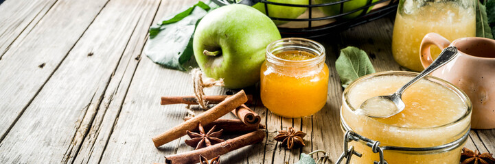 Homemade apple biscuit pie, sponge cake with red and green apples, on a wooden rustic table, with apples and leaves. Top view copy space
