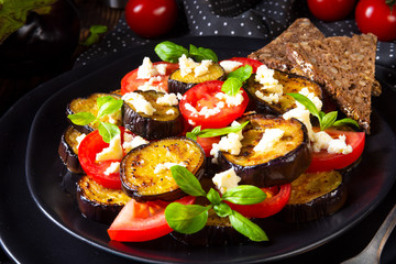 Eggplant grilled with aromatic feta cheese and tomatoes