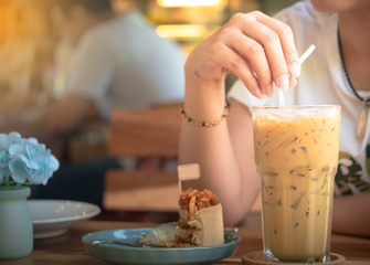 Activity woman drinking iced coffee at coffee shop.(selective focus)
