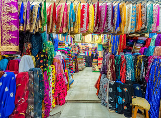 ifferent traditional local clothes are for sale