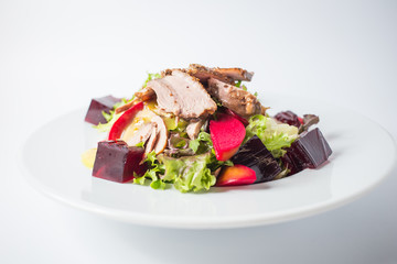 Fresh salad with beef, green, red pear and jellies