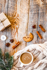 Christmas evening with cup of cocoa wooden background top view