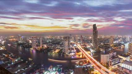 Bangkok capital city of thailand.Scenic landscape of Bangkok skyline with dramatic sky before sunset with modern skyscraper and Chao Phraya river in background.