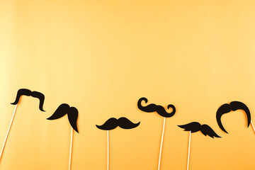 Movember concept. Annual event involving growing of moustache & beard during month in November to...