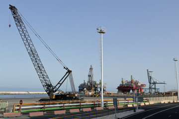 Fototapeta na wymiar A photo of the industrial port of Santa Cruz de Tenerife, Canary Island, Spain, with some cranes and oil rigs