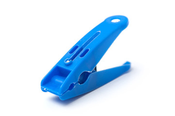 closeup of blue plastic clothespin on white background