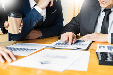 Team work process. young business managers crew working with startup project. laptop in office analyze profit graph plan