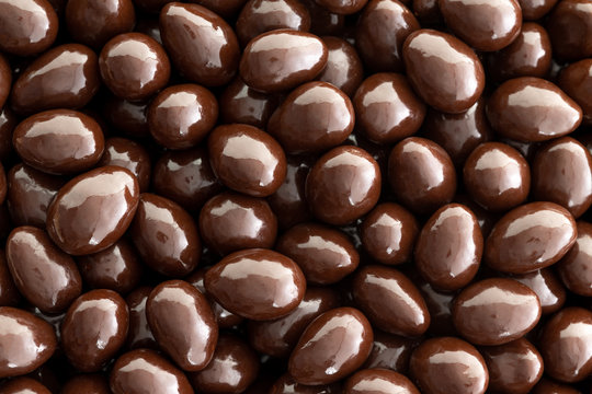 Macro background texture of chocolate almonds