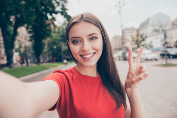 Self-portrait of straight-haired young beautiful smiling girl we