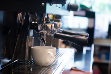 Close up coffee machine in coffee cafe. It's coffeemakers or coffee machines are cooking appliances used to coffee. Making Coffee Preparation Service Concept