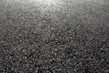 Black asphalt road,background texture close-up