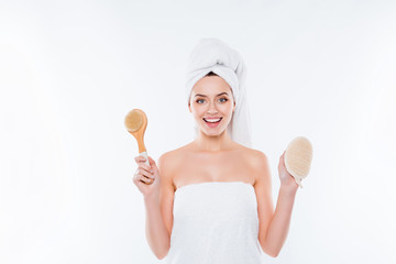 Portrait of positive cheerful woman wrapped in towel with turban