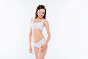 Portrait of thin sportive woman with perfect body in white cotto