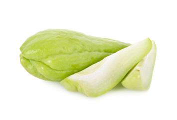 whole and cut fresh Chayote on white background